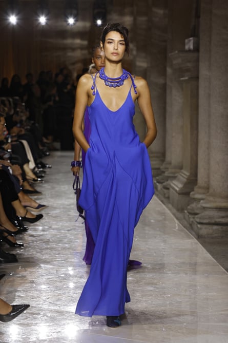 A model wears a dress in the piercing blue of the Mediterranean sea in featherlight organza