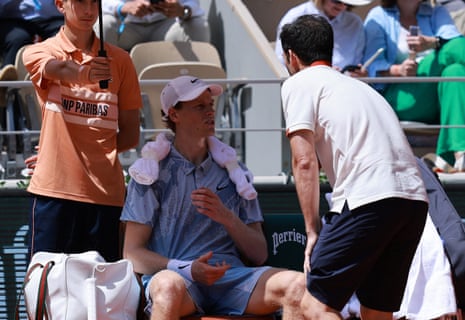 Jannik Sinner receives medical attention during his second round match against Juan Manuel Cerundolo.