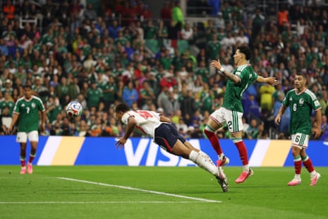 Jude Bellingham of England scores his team's first goal