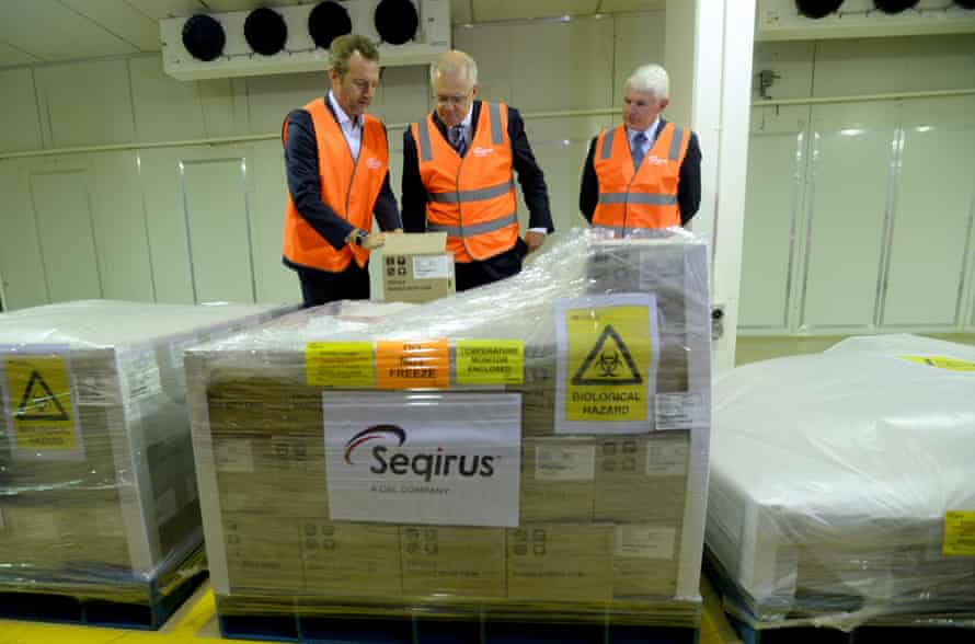 Prime minister Scott Morrison (centre) and Simon Buensch and Dr Brian McNamee of CSL inspect a palette of Covid vaccines while they tour the company’s facility in Melbourne on 26 March. CSL is manufacturing the AstraZeneca vaccine in Australia.