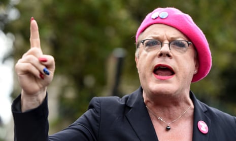 Eddie Izzard wearing red lipstick, and eye make up at a public event