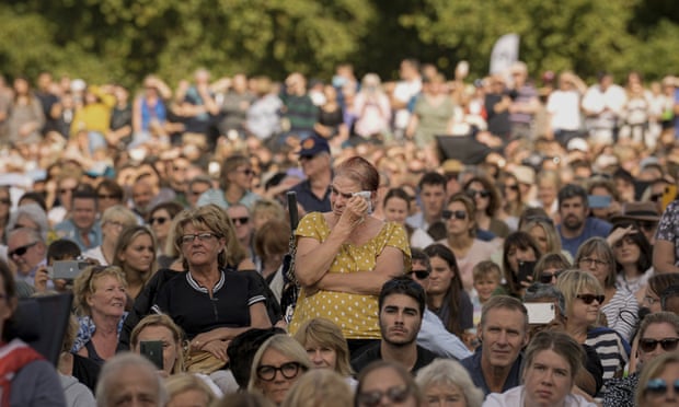 Members of the British public at Hyde Park, London, watch screens showing the procession of the Queen’s coffin to Westminster Hall