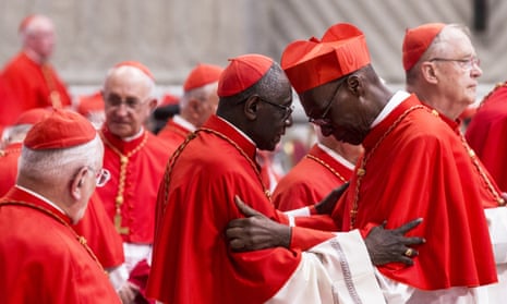 Newly appointed Cardinal Jean Zerbo of Mali is greeted during a consistory ceremony lead by Pope Francis. 