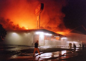 Flames roar from a Thrifty Drug store in the Crenshaw area of Los Angeles on 29 April 1992.