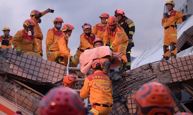 A five-year-old girl is rescued from the collapsed building in Yuli