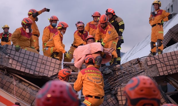 A five-year-old girl is rescued from the collapsed building in Yuli 