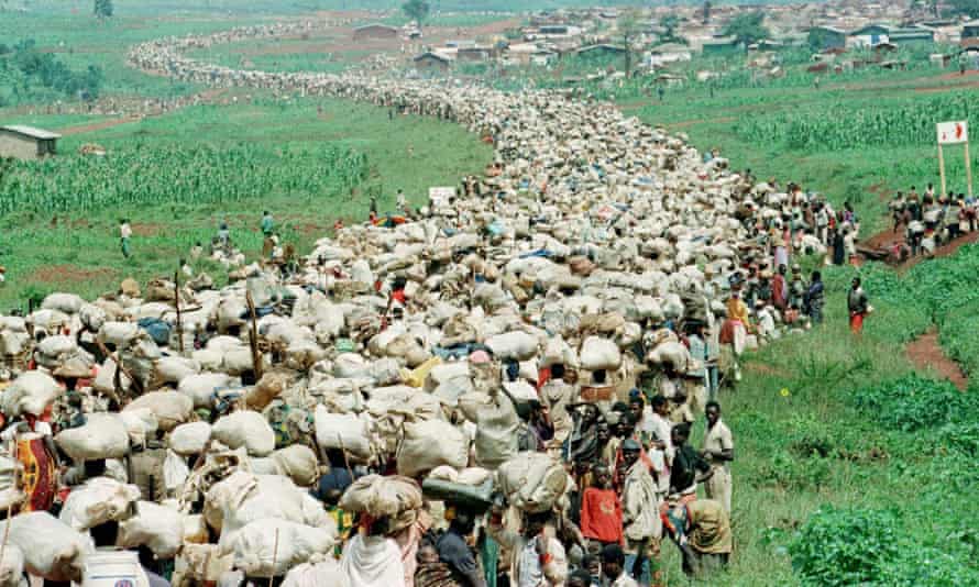 Tens of thousands of Rwandan refugees, forced by the Tanzanian authorities to return to their country despite fears they will be killed upon their return, file back towards the Rwandan border on a road in Tanzania.