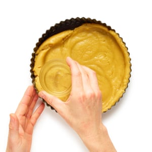 Line a greased tin with hot-butter pastry, then press it in to cover the base and sides, with a little overlap.