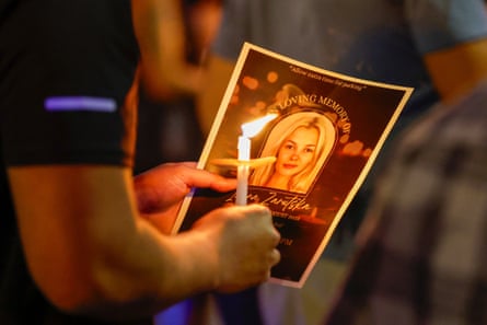 a person holding a candle and a photo of a blond woman