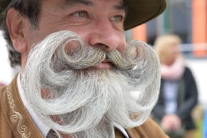 A participant poses for photographers during the “World Beard Championship” in Leogang, in the Austrian province of Salzburg