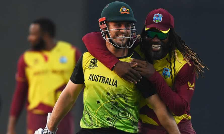 Chris Gayle of West Indies (right) and Mitchell Marsh of Australia.