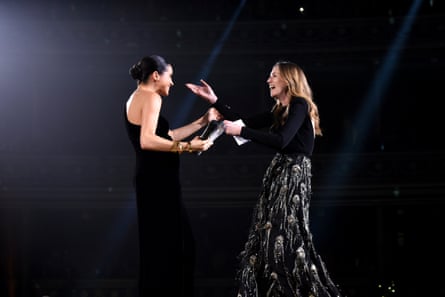 The Duchess of Sussex presents the British womenswear designer of the year to Clare Waight Keller at the 2018 awards