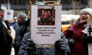 Demonstrators gather protesting climate change outside the office of U.S. Senator Charles Schumer (D-NY) in New York, U.S., January 9, 2017. REUTERS/Shannon Stapleton