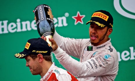 Lewis Hamilton celebrates his victory in Montreal with the second-placed Sebastian Vettel.