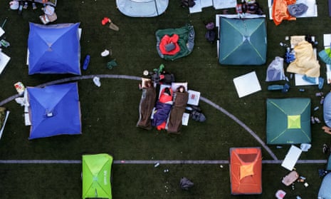 An aerial view of students sleeping in their tents on a football stadium as they take part in a march and protest over the Novi Sad canopy collapse.