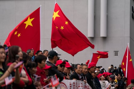Supporters and well-wishers of the Chinese president await his motorcade at the St Regis hotel on 14 November 2023 in San Francisco, California.