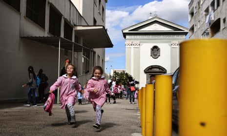 Children run home after school: the elementary school Lenù and Lila would have attended is on the left and the parish church is behind them.