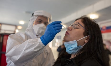 A woman is given the antigen test for Covid-19 in Kosice, Slovakia.