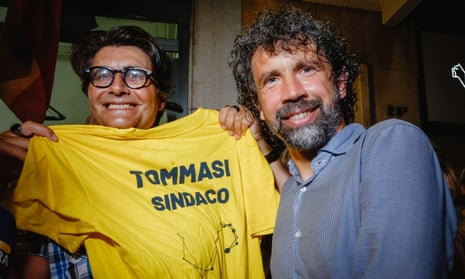 The former AS Roma and Italy footballer Damiano Tommasi (right) with a supporter after becoming the new mayor of Verona