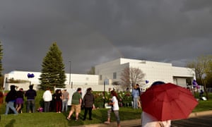 A rainbow emerges over Paisley Park while fans pay their respects to Prince.
