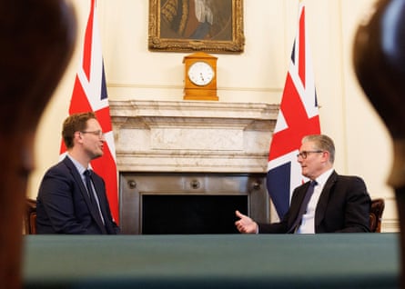 Jones and Starmer sit in front of UK flags in the Cabinet Office.