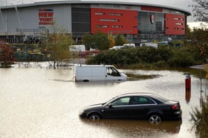 Abandoned cars are pictured in a flooded car park in Rotherham.