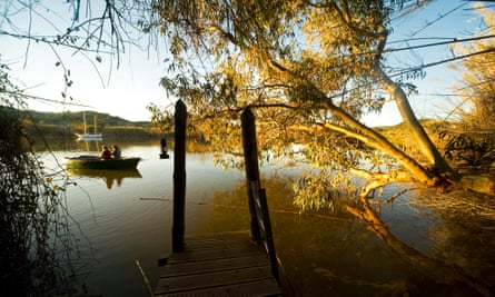 A view across the glassy river from the jetty.