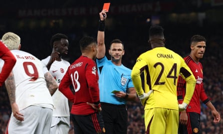 Casemiro is shown a red card while André Onana looks on