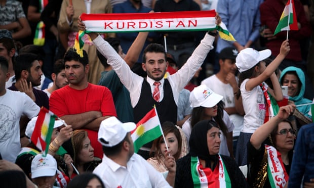 Kurds show their support for the upcoming independence referendum at a rally in Erbil