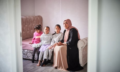 Alifjane Begum, with her three children, says the family would be unable to switch on the heating, buy new clothes or even afford enough groceries.