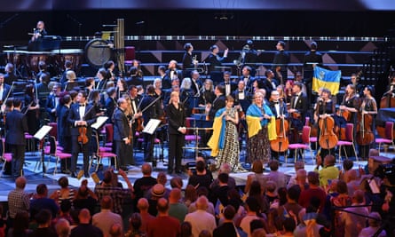 Conductor Keri-Lynn Wilson with Anna Fedorova and Liudmyla Monastyrska at the end the performance by Ukrainian Freedom Orchestra at the BBC Proms.