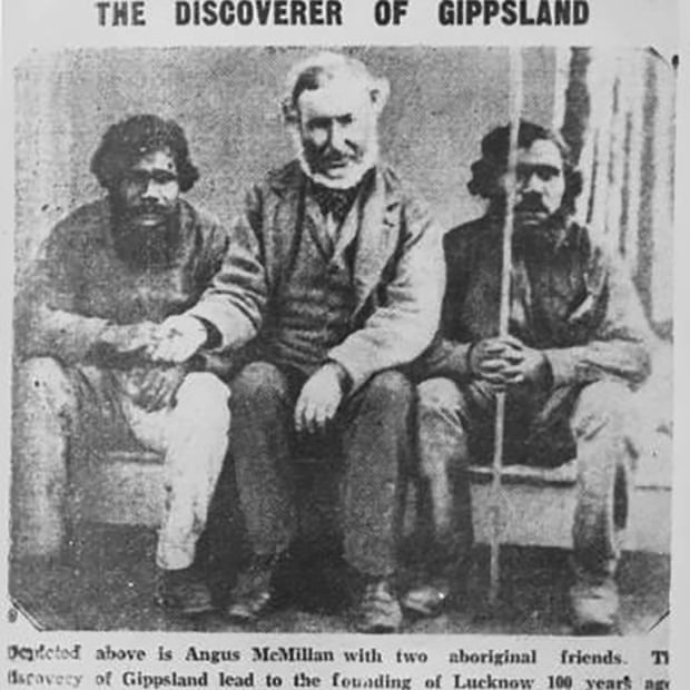 Angus McMillan sitting with two Aboriginal men