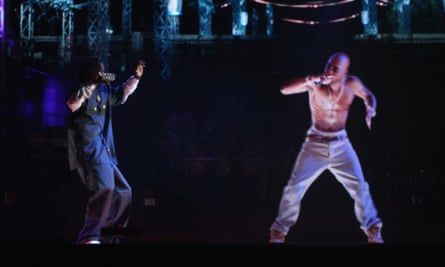 Snoop Dogg (L) and a hologram of Tupac Shakur perform at the 2012 Coachella festival.
