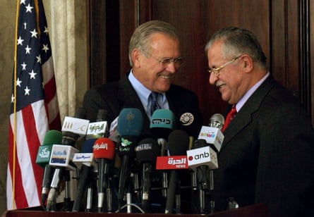 US defence secretary Donald Rumsfeld and Iraqi president Jalal Talabani laugh after a media briefing in Baghdad’s fortified Green Zone on 27 July 2005.