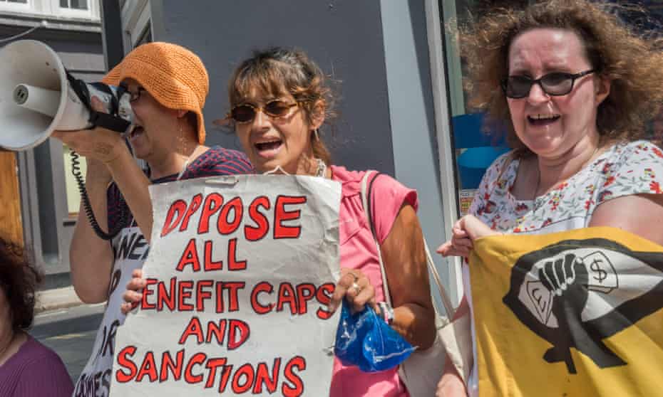 A group protests benefit cuts