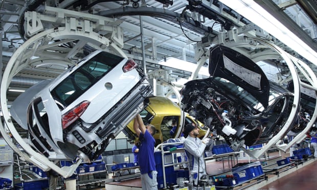 Volkswagen workers on an assembly line in Wolfsburg, Germany