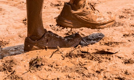 Muddy feet and shoes at the Mud Day race, a 13km obstacle course, in Tel Aviv.