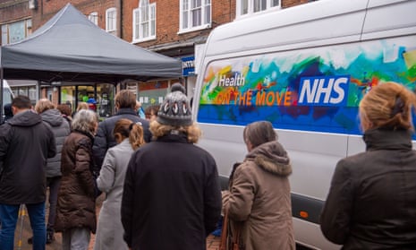 People queue in Chesham town centre, Buckinghamshire, for Covid-19 vaccine doses.