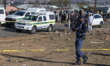 Police at the scene of the mass shooting at a bar in Soweto, South Africa