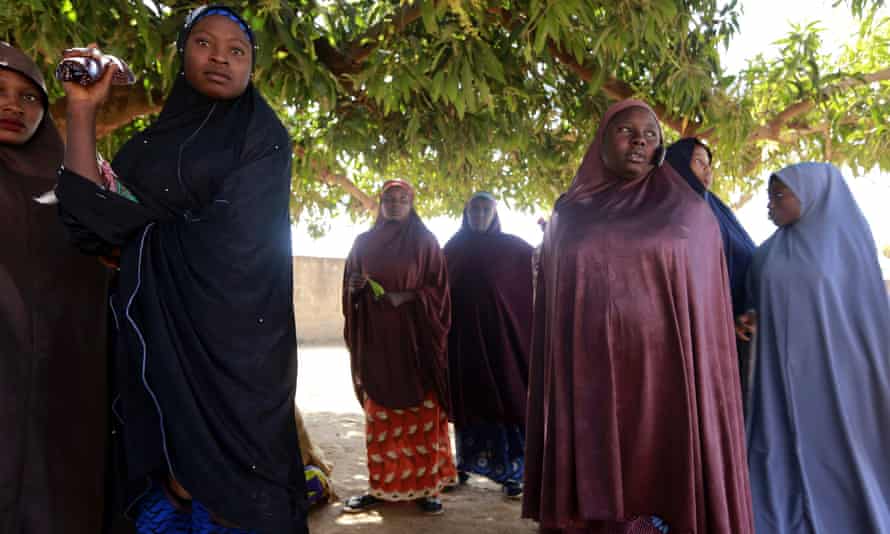 Parents gather at the Government Science school after gunmen abducted students in Kankara.