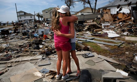 Brenda Roby hugs her neighbor Donna Hanson in the aftermath of Hurricane Ike on 24 September 2008, in Galveston, Texas.