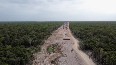Protesters gather at the site of section 5 of the Maya Train, where it is feared construction will impact a system of cenotes known as Dama Blanca (White Lady), in Playa del Carmen, 30 April.