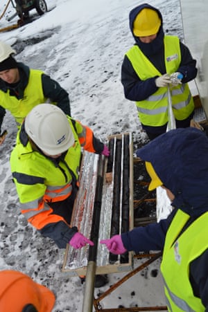 Members of the CarbFix science team handling rock core recovered during drilling at the CO2 injection site.