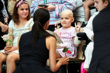 Meghan interacts with a girl as she visits the Royal children’s hospital in Melbourne