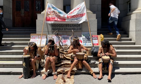 Members of the Khoi people picket outside the high court in Cape Town to oppose development of a site that will house Amazon.
