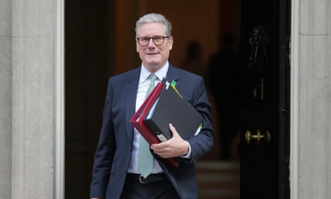 Keir Starmer emerges from Downing Street holding some folders