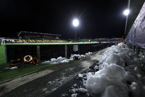 Deep piles of snow have been swept and shovelled behind the advertising hoardings at Bodo/Glimt's Aspmyra Stadion.