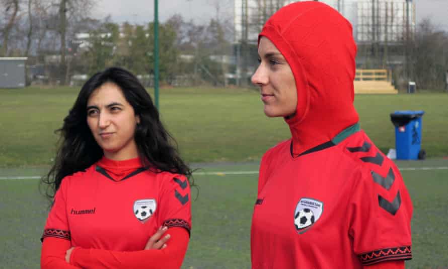 The former Afghanistan captain Khalida Popal with current Afghanistan player Shabnam Mabarz, who is wearing the new head-to-toe outfit with an integrated hijab.