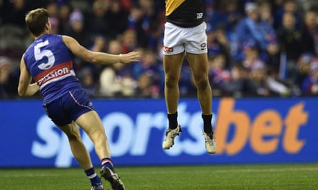 Sportsbet sign on the boundary fence at an AFL match