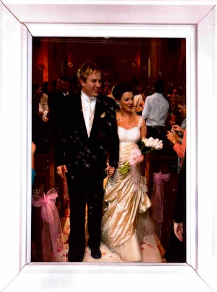 A traditional groom and bride walking back up the aisle at church